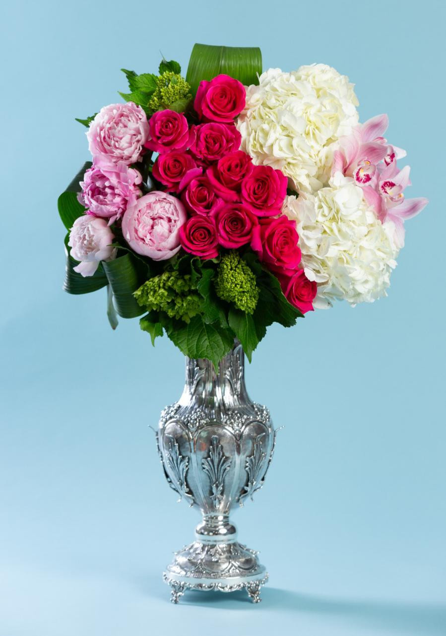 Buds flowers arranged in a silver vase